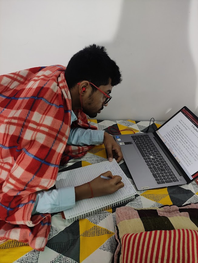 Navneet taking notes, clicked without consent by his sister in early 2024 at Rewa, Madhya Pradesh